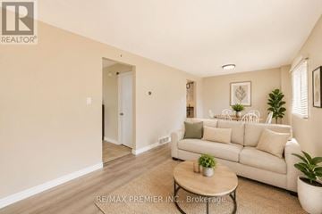 Waterloo townhouse for rent - A living room with a white couch and a coffee table.