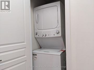 Mississauga (City Centre) condo for rent - A white dishwasher is installed in a kitchen.