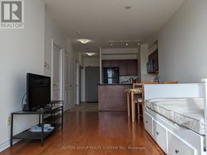 Mississauga (City Centre) condo for rent - A living room with a television, a couch, and a bed.