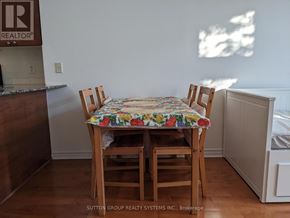 Mississauga (City Centre) condo for rent - A dining room with a table and chairs.