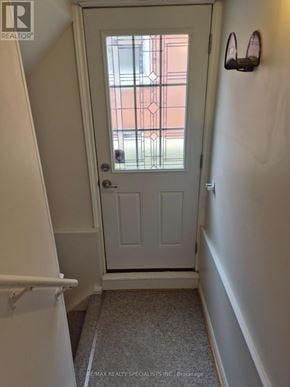 Vaughan (Brownridge) apartment for rent - A white door with a glass window in a hallway.
