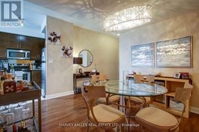 Mississauga (City Centre) condo for rent - A dining room with a glass table and chairs.