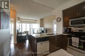 Mississauga (City Centre) condo for rent - A kitchen with a refrigerator, sink, and oven.