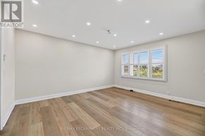 Woodstock (Woodstock - North) apartment for rent - A room with wooden flooring and a window with blinds.
