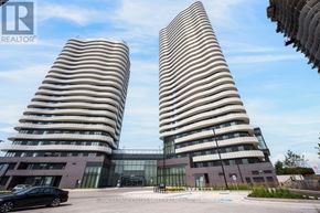 Vaughan (Steeles West Industrial) condo for rent - Two tall buildings with striped facades stand side by side.