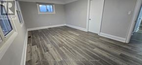 Oshawa (Vanier) apartment for rent - A room with wood flooring and a window.