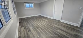 Oshawa (Vanier) apartment for rent - A room with wood flooring and a window.