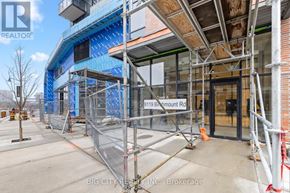 Markham (Unionville) condo for rent - A construction site with scaffolding and a sign that reads "819 Birmingham Rd".