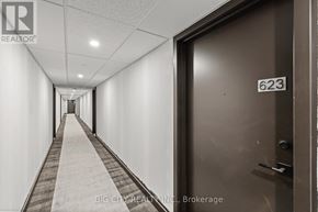 Markham (Unionville) condo for rent - A hallway with a door numbered 623 on the right.