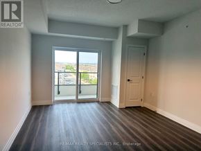 Milton (Co Coates) condo for rent - A room with a sliding glass door leading to a balcony.