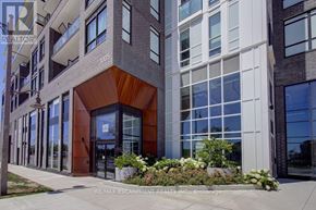 Oakville (Wm Westmount) condo for rent - A modern building with a brown and white facade and a large glass window.