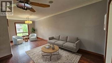 Windsor apartment for rent - A living room with a grey couch and a coffee table.