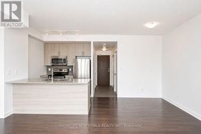 Mississauga (Creditview) condo for rent - A modern kitchen with white cabinets and a wooden island.