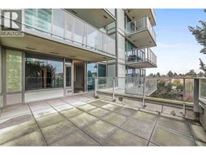 Vancouver apartment for rent - A balcony of a building with glass railings and a glass door.