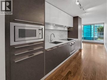 Vancouver apartment for rent - A modern kitchen with a stainless steel microwave and oven.