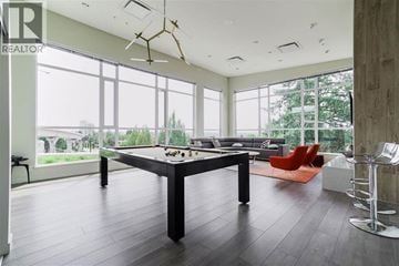 Coquitlam apartment for rent - A modern living room with a large table and chairs.