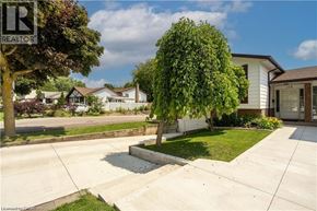 Hamilton apartment for rent - A house with a sign that says REALTOR in front of it.
