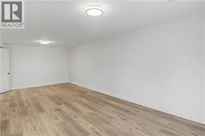 Hamilton apartment for rent - A room with wooden flooring and white walls.