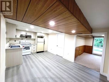 Toronto (Bendale) apartment for rent - A kitchen with a refrigerator, oven, and microwave.