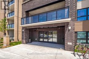 Guelph (Pineridge/Westminster Woods) condo for rent - A building entrance with a glass door and a brick facade.