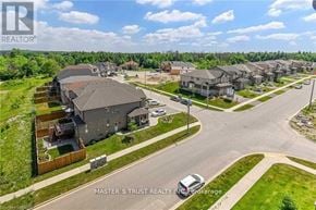 Guelph (Pineridge/Westminster Woods) condo for rent - A real estate company logo is displayed on a residential street.