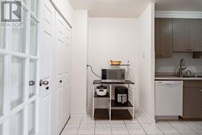 Mississauga (Applewood) condo for rent - A kitchen with white cabinets and a white dishwasher.