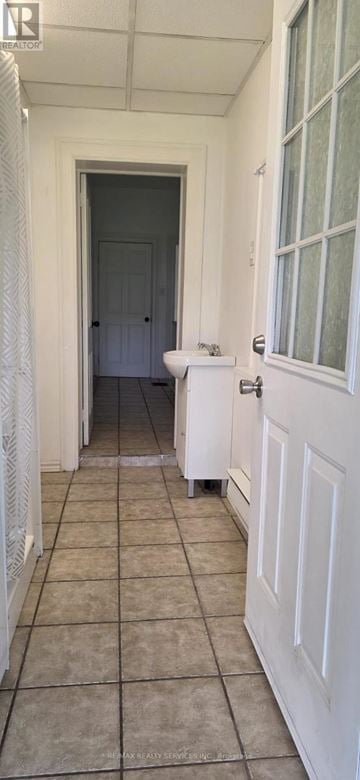 Cambridge apartment for rent - A white door is open to a dark hallway.