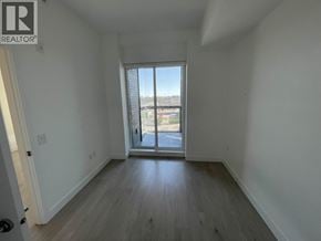 Vancouver apartment for rent - A room with a sliding glass door leading to a parking lot.