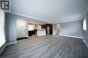 Cambridge apartment for rent - A spacious room with a grey floor and white walls.