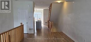Oshawa (Donevan) townhouse for rent - A realtor photo of a home with a white door and a window.
