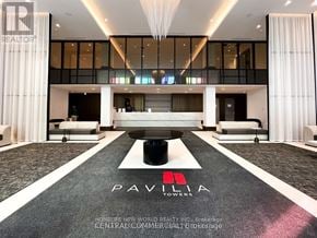 Markham (Commerce Valley) condo for rent - A large open space with a black and white carpet and the word "PAVIA" written on it.