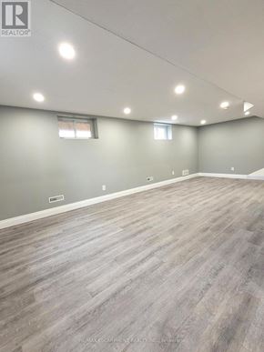 Cambridge apartment for rent - A room with grey walls and wooden flooring.