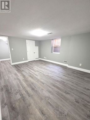 Cambridge apartment for rent - A room with a grey floor and white walls.