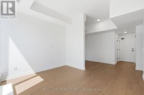 Toronto (Forest Hill South) condo for rent - A large, empty room with a wooden floor and white walls.