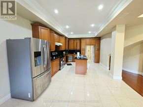 Toronto (Centennial Scarborough) apartment for rent - A kitchen with a refrigerator, cabinets, and a counter.