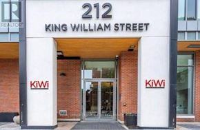Hamilton (Beasley) condo for rent - The front of a building with the number 212 on it.