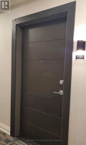 Hamilton (Beasley) condo for rent - A black door with a silver handle and a number 720 on the wall.