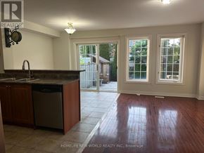 Whitby (Taunton North) townhouse for rent - A kitchen with a dishwasher and a sink.