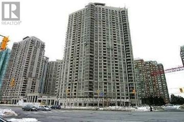 Mississauga (City Centre) condo for rent - A large building under construction with a crane in the background.