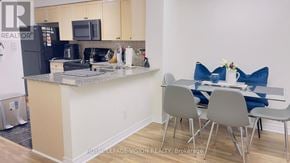 Toronto (Bendale) condo for rent - A kitchen with a breakfast table and chairs.