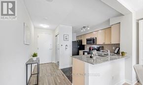 Toronto (Bendale) condo for rent - A kitchen with a counter top and a sink.
