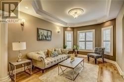 Toronto (Highland Creek) apartment for rent - A well-lit living room with a sofa, armchair, and coffee table.