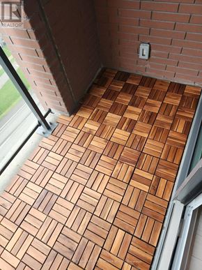 Toronto (Humber Heights) condo for rent - A tile floor with a brick wall and a window.