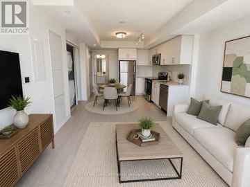 Toronto (Humber Heights) condo for rent - A modern living room with a white couch, a coffee table, and a dining table with chairs.