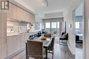 Mississauga (Port Credit) condo for rent - A modern kitchen with a dining table and chairs.