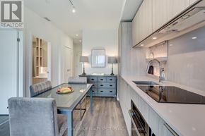 Mississauga (Port Credit) condo for rent - A modern kitchen with a dining table and chairs.