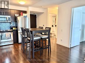 Toronto (Willowdale East) condo for rent - A kitchen with a dining table and chairs.