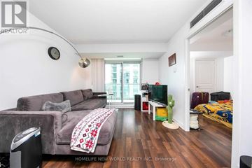 Toronto (Willowdale East) condo for rent - A living room with a grey couch and a wooden floor.