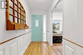 Mississauga (Clarkson) apartment for rent - A hallway with a blue door and white walls.