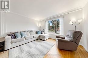 Mississauga (Clarkson) apartment for rent - A living room with a grey couch and a grey armchair.